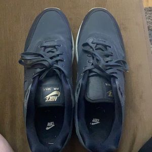 Women’s size 10 black, white, gold Nike air max.